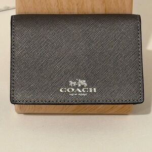 COACH SIGNATURE BI-FOLD MINI WALLET